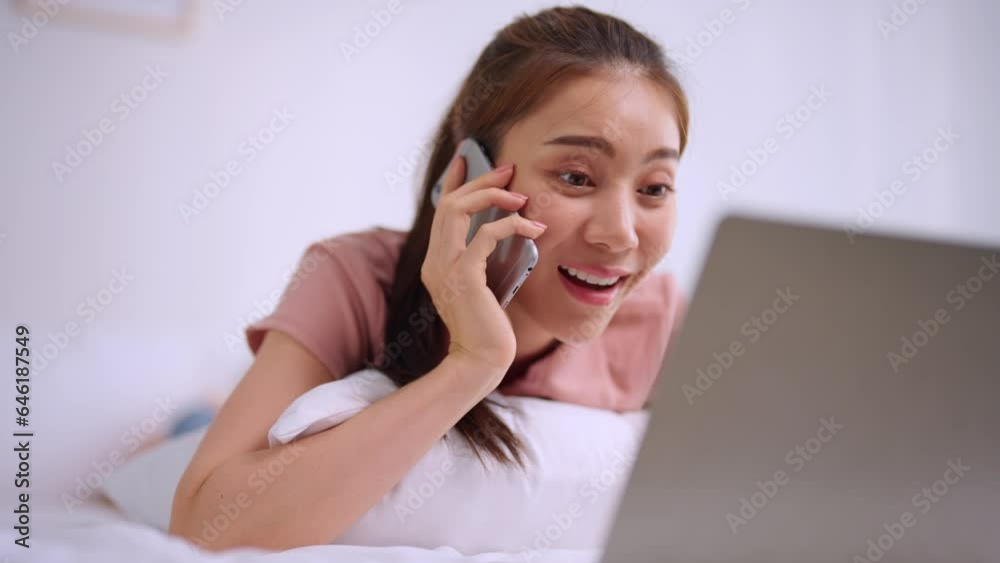 Asian attractive woman using laptop chat on bed at home in the morning. Asian attractive woman using laptop chat on bed at home in the morning.
