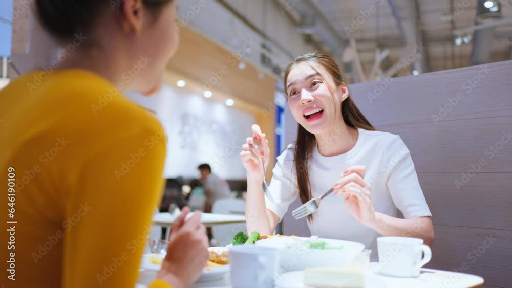 Asian beautiful women having dinner with friend in restaurant together. Asian beautiful women having dinner with friend in restaurant together.