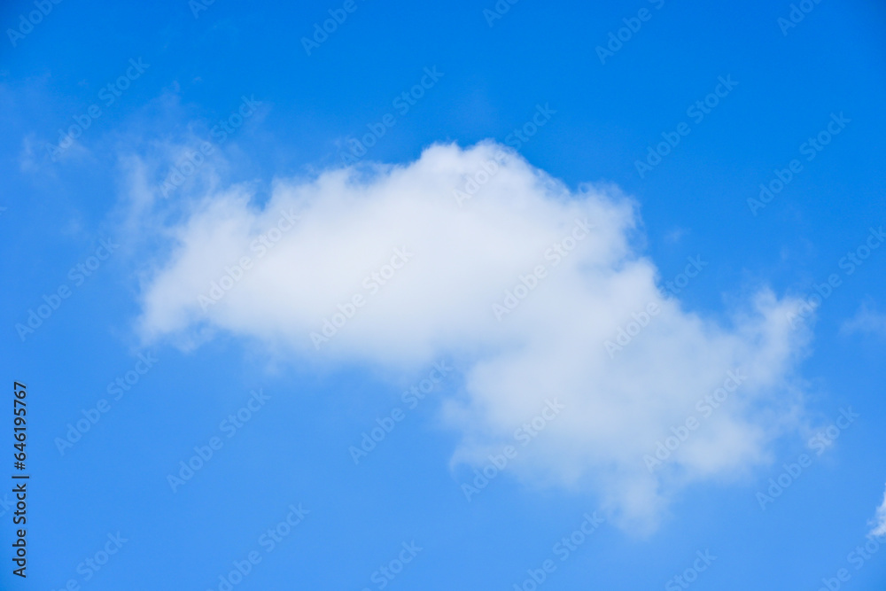 beautiful blue sky and white fluffy single cloud with sunrise in the morning, natural background beautiful blue sky and white fluffy single cloud with sunrise in the morning, natural background