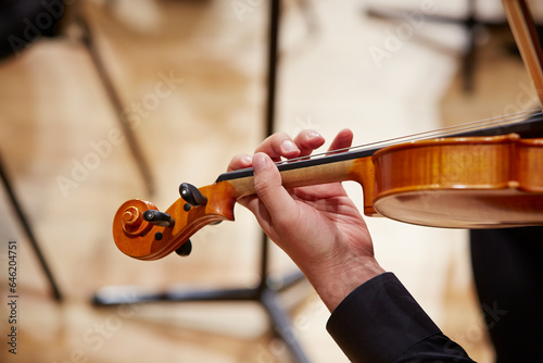 Close up of musician hands playing violin	