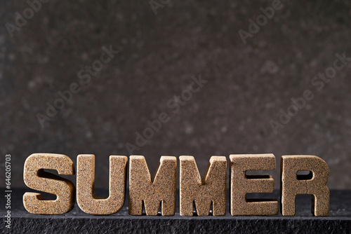 'Summer' alphabet word on dark background