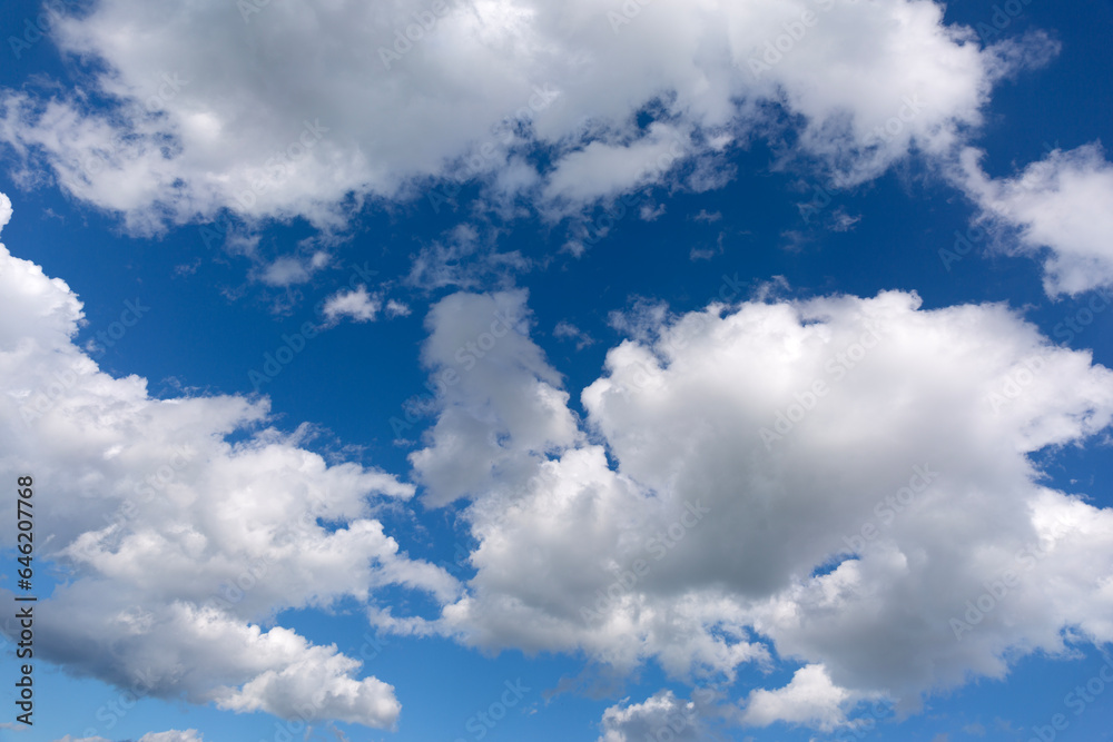 Naklejka premium White clouds on blue sky background.