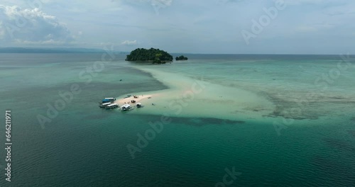 Vanishing Island with tourboat at coast and Turtle Island in Barobo, Surigao del Sur. Philippines. photo