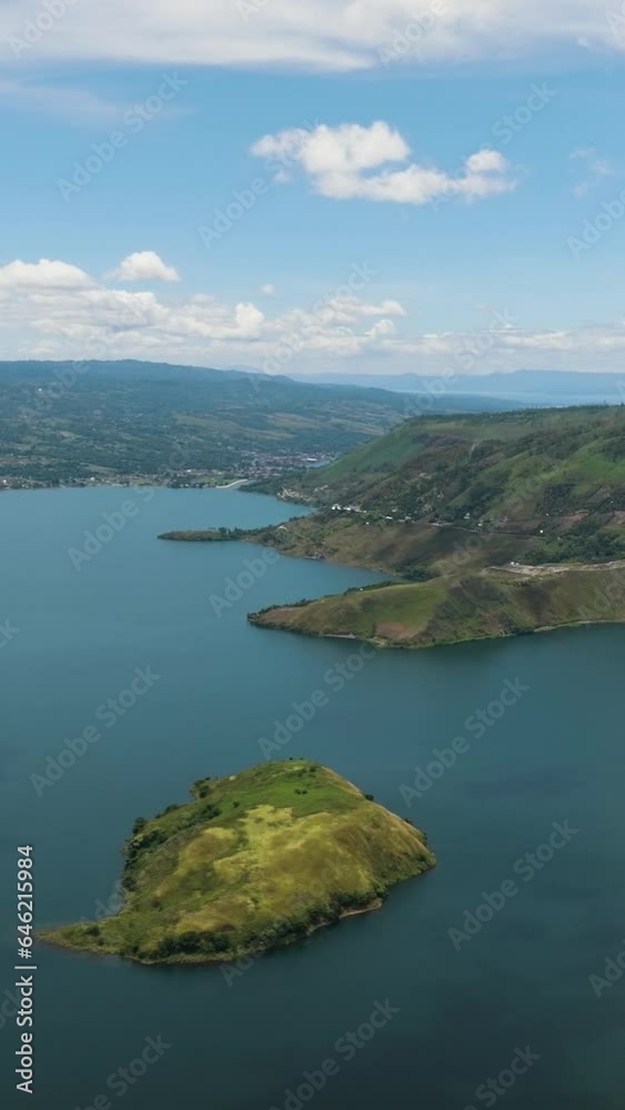 Aerial drone of lake Toba lies in the northern part of Barisan Mountain Range. Sumatra, Indonesia. Aerial drone of lake Toba lies in the northern part of Barisan Mountain Range. Sumatra, Indonesia.