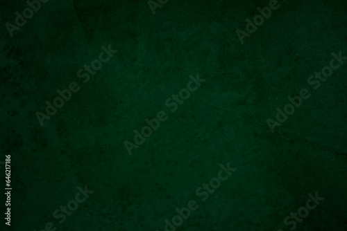Green chalkboard texture for school display backdrop. chalk traces erased with copy space for add text or graphic design grunge background. Green board. Dark green wall backdrop. Education concepts.