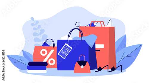 Shopping bags expanding with items vector illustration. Discounted products and accessories with sale labels and percentage tags. Black Friday, shopping, commerce, business concept