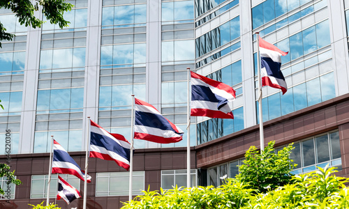 Thailand flag pole in front of building © Ratchapon