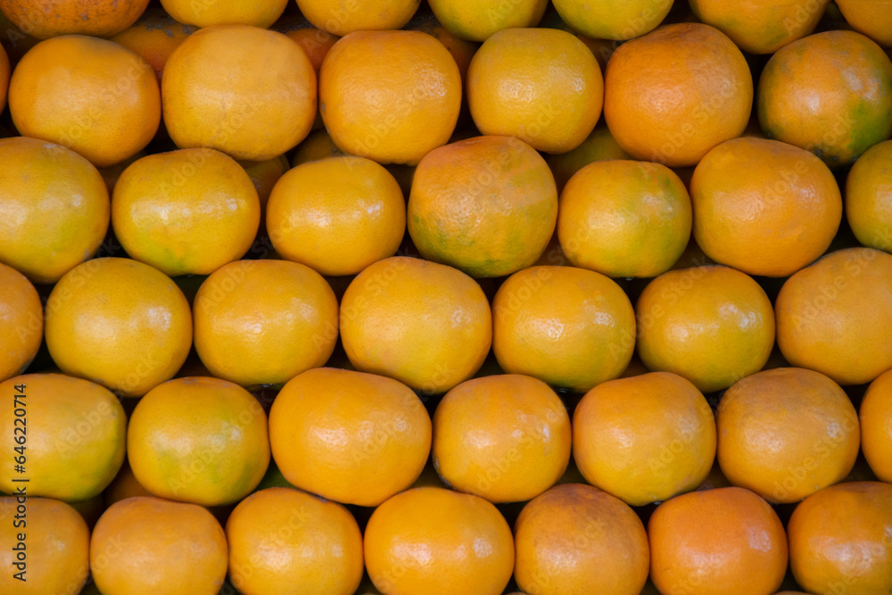 Tangerine oranges Green and orange for sale in the colorful fruit market. Tangerine oranges Green and orange for sale in the colorful fruit market.