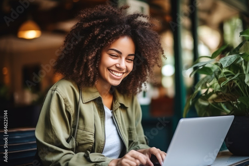 African afro american student girl smile using notebook laptop, woman study online hybrid learning in coworking third space