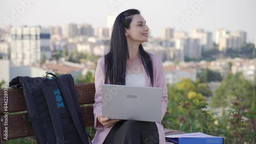 Businesswoman working outdoors. photo