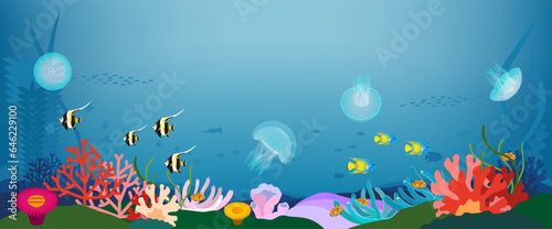 珊瑚礁の海中に漂うクラゲと熱帯魚の背景素材