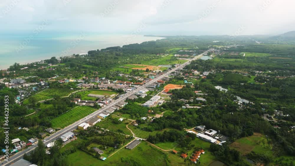 Khao Lak longest National Highway 4 runs along the coast, Thailand, Slow motion Drone shot Khao Lak longest National Highway 4 runs along the coast, Thailand, Slow motion Drone shot