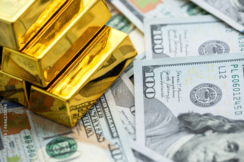 gold bars reflection on dollar bills background. The concept of finance wealth and rich gold bars reflection on dollar bills background. The concept of finance wealth and rich