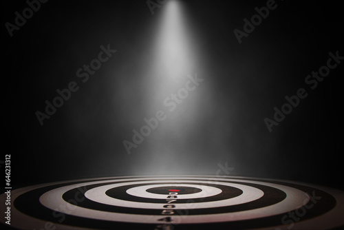 White smoke spotlight on bullseye stage background.