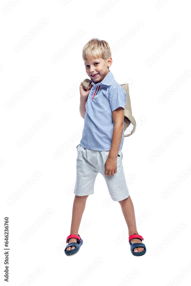 A smiling boy with a backpack is standing. Back to school. Isolated on white background. Vertical. A smiling boy with a backpack is standing. Back to school. Isolated on white background. Vertical.