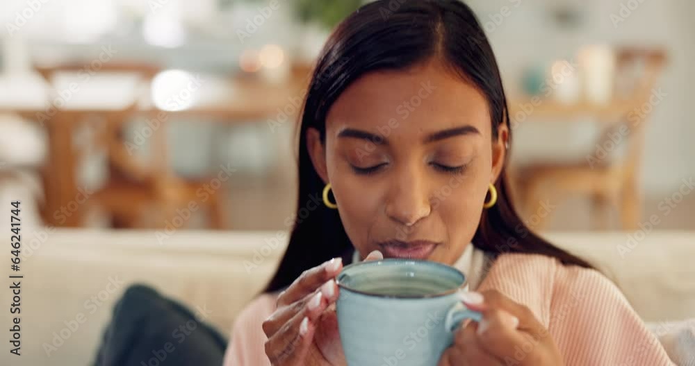 Indian woman, morning or coffee to relax with calm peace on break at home living room in winter. Face, thinking or girl drinking hot beverage mug for tea or cappuccino on house or apartment sofa