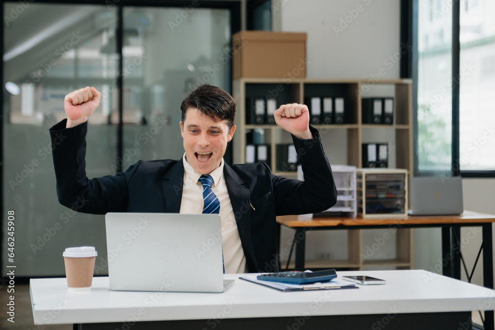 business man are delighted and happy with the work they do on their tablet, laptop and taking notes at the office. business man are delighted and happy with the work they do on their tablet, laptop and taking notes at the office.