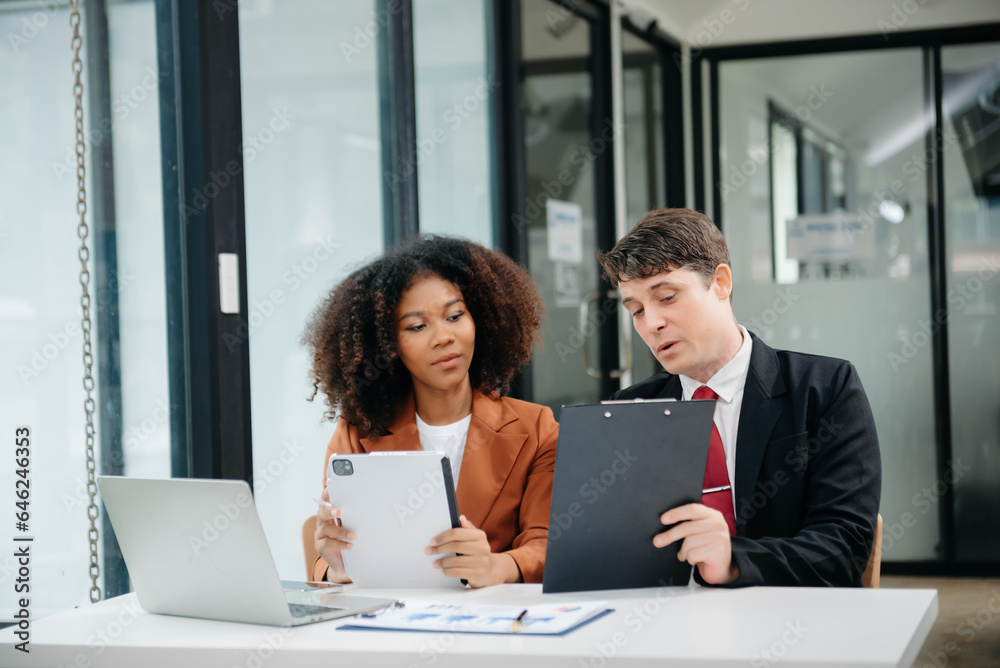 Portrait of success business people working together in home office. Couple teamwork startup concept Portrait of success business people working together in home office. Couple teamwork startup concept