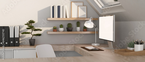 A minimalist white home office workspace with a computer on a wooden corner table.