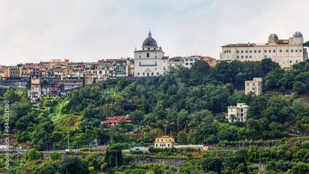 Castel Gandolfo city skyline with famous dome of San Tommaso da Villanova church with Papal summer residence and astronomical observatory with its white domes
