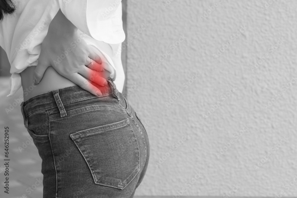 woman with back pain symptoms, office syndrome; portrait of asian woman