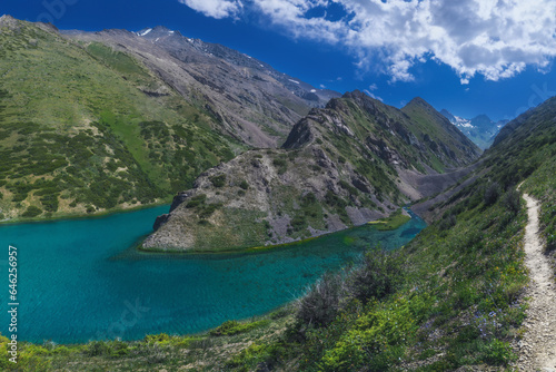Panorama landscape with a blue lake in the mountains in summer. Koksai Ainakol Lake in Tien Shan Mountains in Asia in Kazakhstan © alexkoral