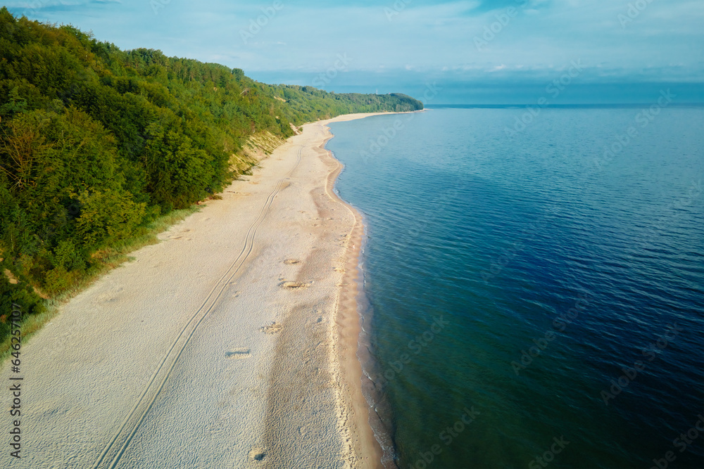 Aerial view of sea landscape with sand beach in Wladyslawowo. Baltic sea coastline in Poland. Resort town in summer season