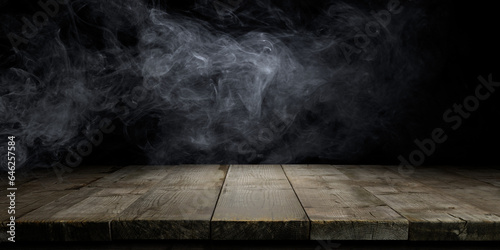 Wood table and smoke on dark background.
