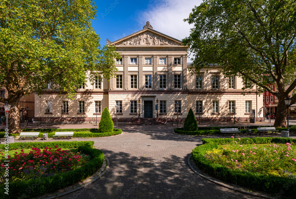 Historic assembly hall called “Alte Aula“, is a public monument and sight in Goettingen in Lower Saxony Germany. Frontal view of mMain building of the famous research university on a sunny day in July