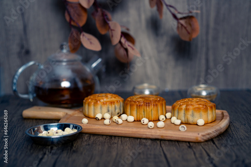 Chinese mid-autumn mooncake festival with egg yolk and tea
