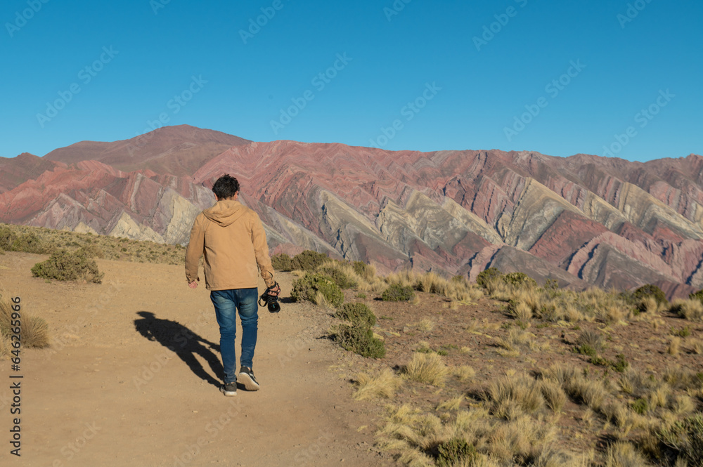 Fototapeta premium People in the Serrania de Hornocal, the hill of the fourteen colors in the Quebrada de Humahuaca , Jujuy, Argentina in 2023.