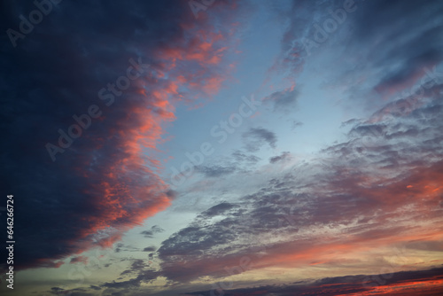 Sunset sky with orange clouds. Nature background. © Vladimir Arndt
