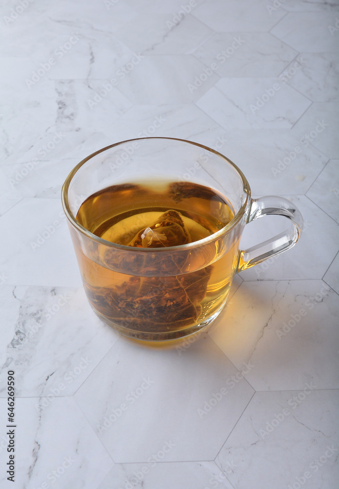 premium hot brew organic chinese green western black tea leaf bag hand pour in whisky glass pot and cup on luxury white marble table halal food beverage cafe drink menu design premium hot brew organic chinese green western black tea leaf bag hand pour in whisky glass pot and cup on luxury white marble table halal food beverage cafe drink menu design