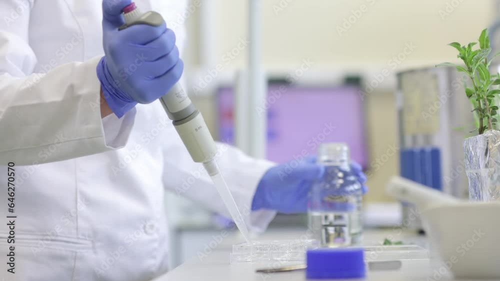 Young scientist or researcher woman developing new bio, ecological cosmetics product in the modern laboratory, industrial concept