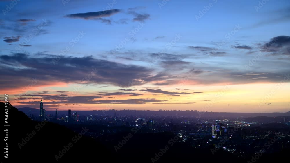 Fantasy orange sky. The vibrant and bustling night scene of Taipei City. Night view of the city surrounded by mountains is hazy and dreamy. Dajianshan, Taiwan Fantasy orange sky. The vibrant and bustling night scene of Taipei City. Night view of the city surrounded by mountains is hazy and dreamy. Dajianshan, Taiwan