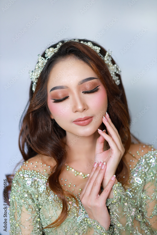 Portrait of beautiful asian girl with flawless makeup Beauty face. Photo taken in the studio. Portrait of beautiful asian girl with flawless makeup Beauty face. Photo taken in the studio.
