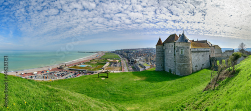 Castle with city near sea under cloudy sky photo