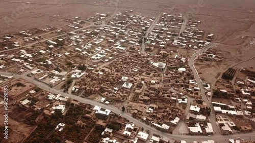 Pomegranate garden and historical desert old city map drone aerial view of civilization in Iran local people life brown color architecture and concept of eco resort lodge in UTAH in a hazy day dust photo