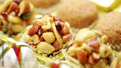 Close-up of different types of Indian sweets, for Diwali festival. Khoa Ladoo, Dryfruits Ladoo.
