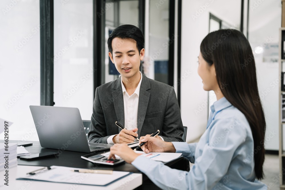 Asian businessman discuss with new startup project Idea presentation, analyze planning and financial statistics and investment market at office. Asian businessman discuss with new startup project Idea presentation, analyze planning and financial statistics and investment market at office.