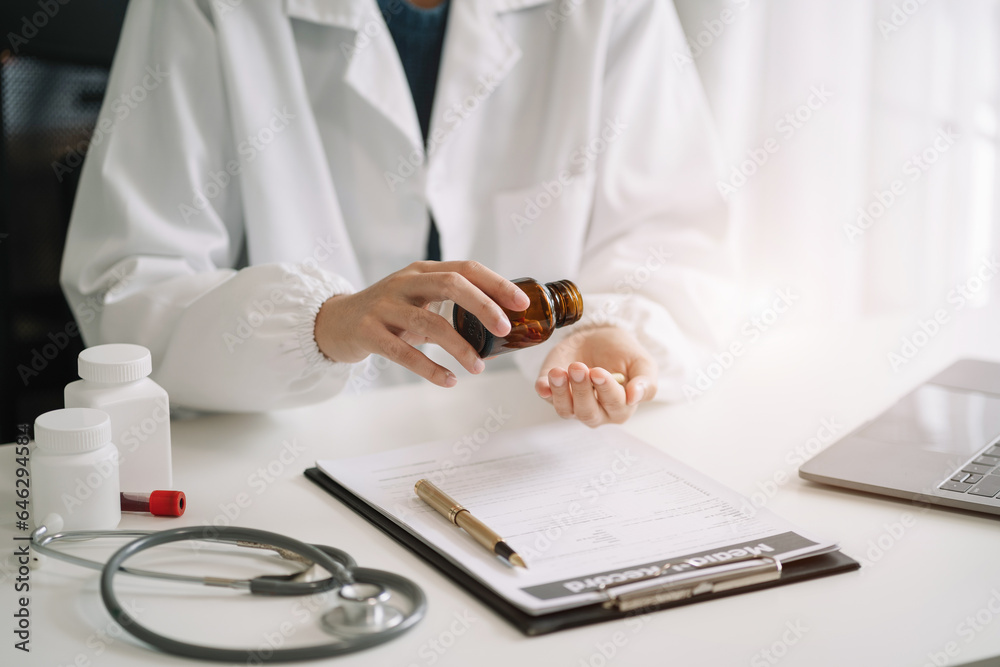 Pharmacists or doctors study information about tablets in the room Pharmacists or doctors study information about tablets in the room