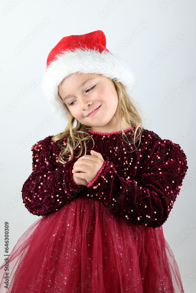 Portrait of a beautiful little girl wearing a Christmas holiday outfit