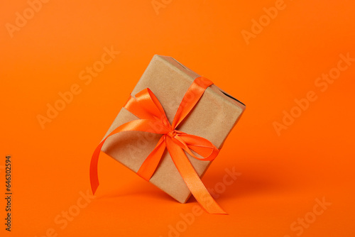 Autumn gift box on an orange background