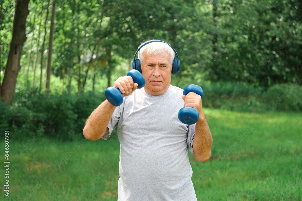 Senior man working out outdoors. Person lifting dumbbells. Old male exercising at park. Healthy people lifestyle. Active sport training. Older elderly sportsman doing fitness exercise. Workout session Senior man working out outdoors. Person lifting dumbbells. Old male exercising at park. Healthy people lifestyle. Active sport training. Older elderly sportsman doing fitness exercise. Workout session