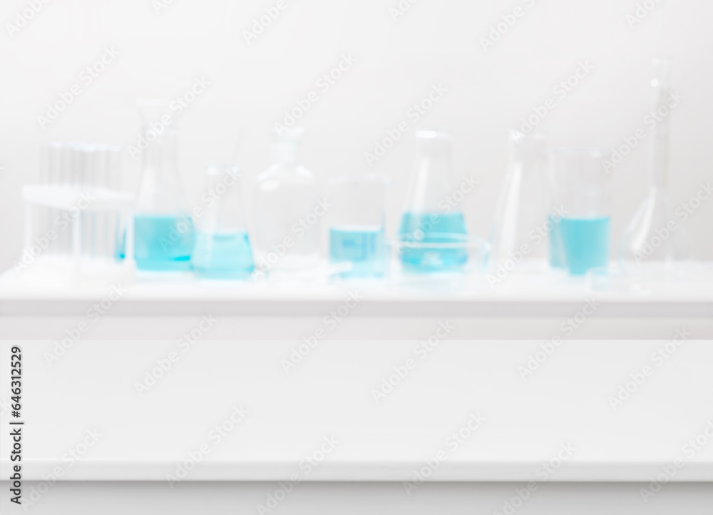 Blank table on abstract blurred background of chemical lab equipment Blank table on abstract blurred background of chemical lab equipment