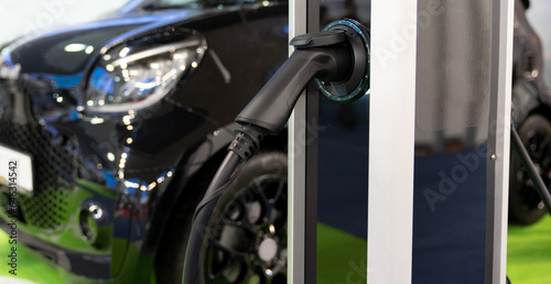 Close-up of an electric car with a cable