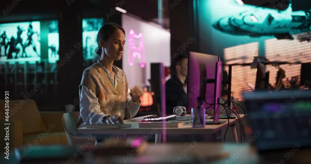 Female Talented Digital Marketing Specialist Working on Computer at Office in the Evening. Young Caucasian Businesswoman in Creative Agency, Smiling and Researching Business Analytical Data. Zoom Out Female Talented Digital Marketing Specialist Working on Computer at Office in the Evening. Young Caucasian Businesswoman in Creative Agency, Smiling and Researching Business Analytical Data. Zoom Out
