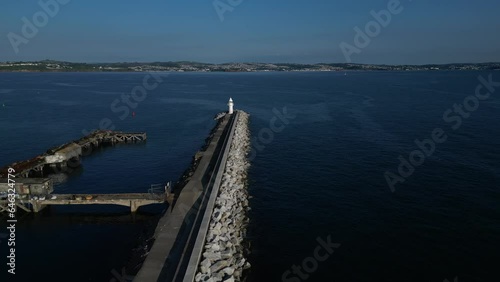 Wallpaper Mural Brixham, Torbay, South Devon, England: DRONE VIEW: Brixham Harbour Lighthouse & the Outer Harbour Wall. Brixham is both a fishing port and a popular UK summer holiday resort and tourist destination. Torontodigital.ca