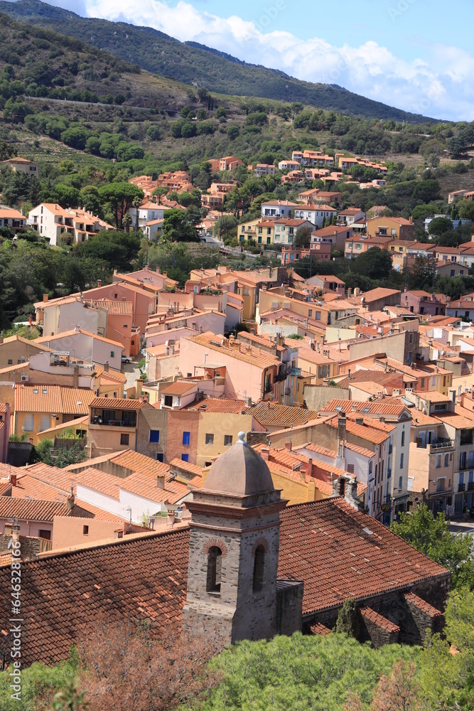 View over Collioure, a Mediterranean seaside town in southern France featuring houses with terracotta roof tiles