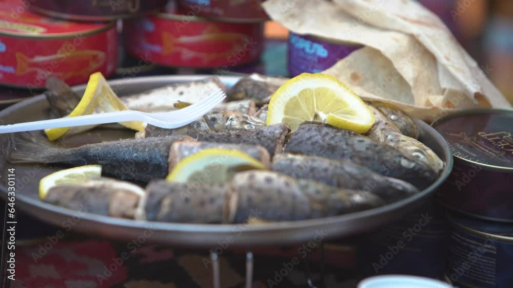 Close view cooked fish. deliciously cooked trout fish with lemon․ Sliced fish with lemon․ Healthy food․ Close view cooked fish. deliciously cooked trout fish with lemon․ Sliced fish with lemon․ Healthy food․